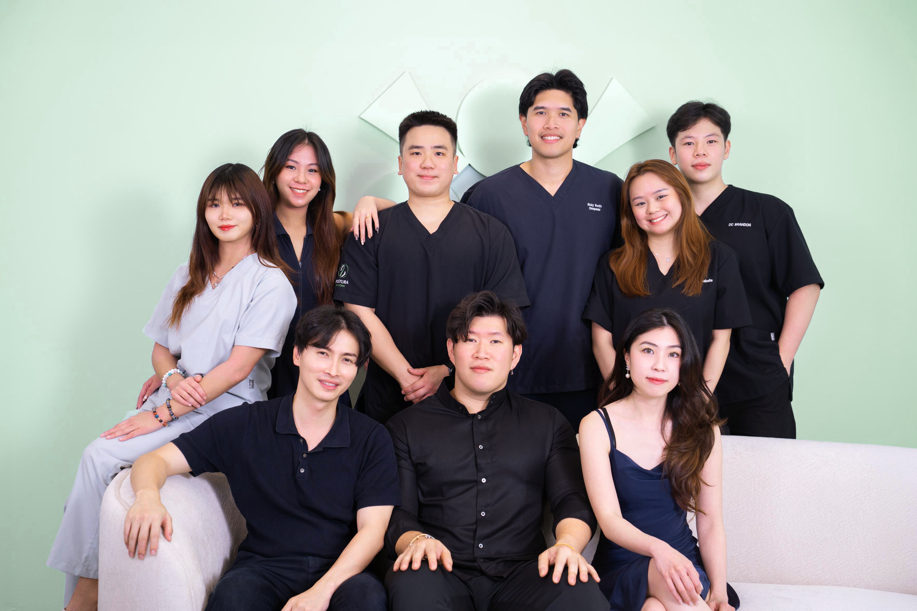 The Postura Wellness team — chiropractors, physiotherapists and clinic staff together at the clinic
